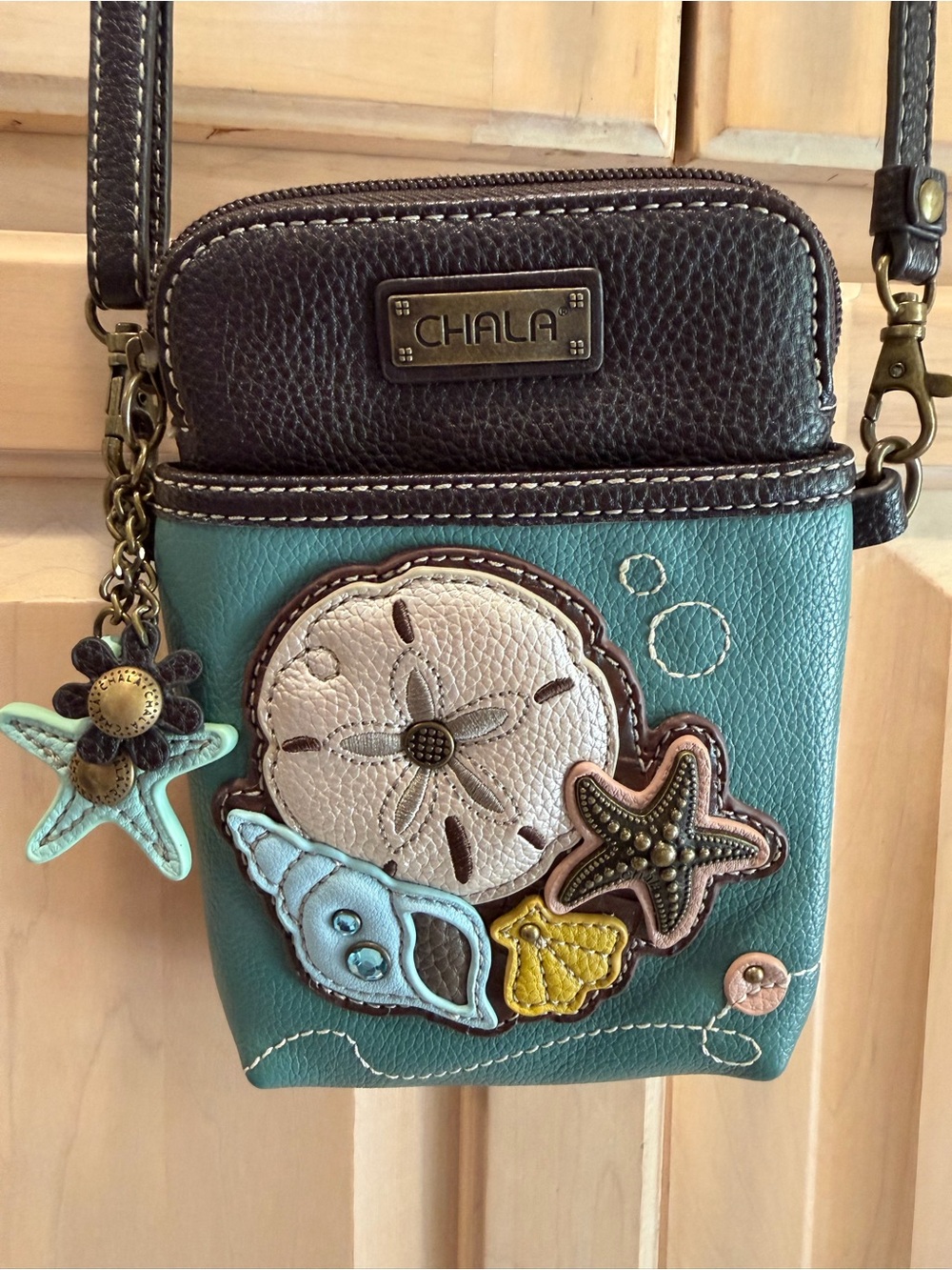 Chala Teal Shell Appliqué Crossbody Bag with Brown Trim